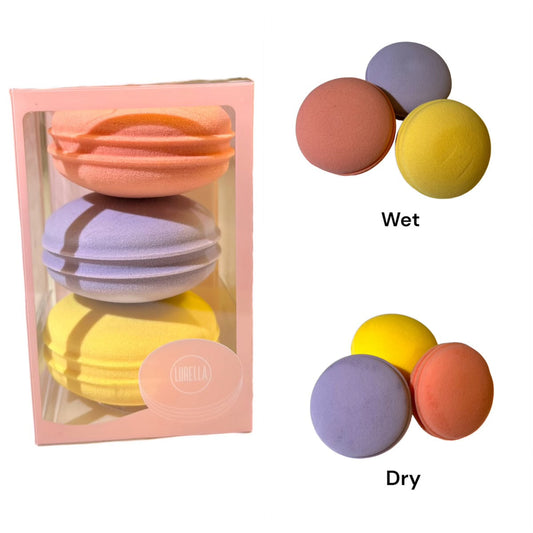 Set of colorful makeup sponges with a pink packaging box, showing wet and dry states.